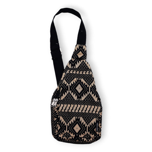 Handmade cross body bag featuring earthy tones and a geometric jacquard weave design with a slim strap.