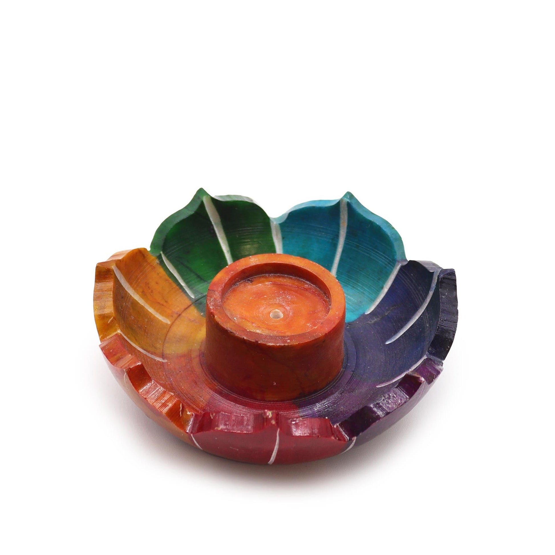 Small soapstone incense holder carved into a lotus flower shape with colourful sections representing the seven chakras.