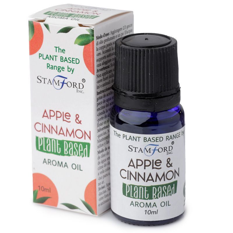 Bottle of apple cinnamon scented plant based aroma oil on a neutral background.