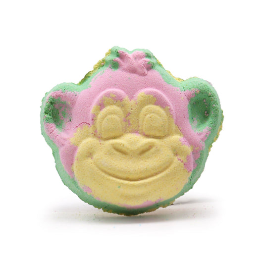 Playful monkey-shaped bath bomb with a detailed face design and soft pink and yellow tropical colours.