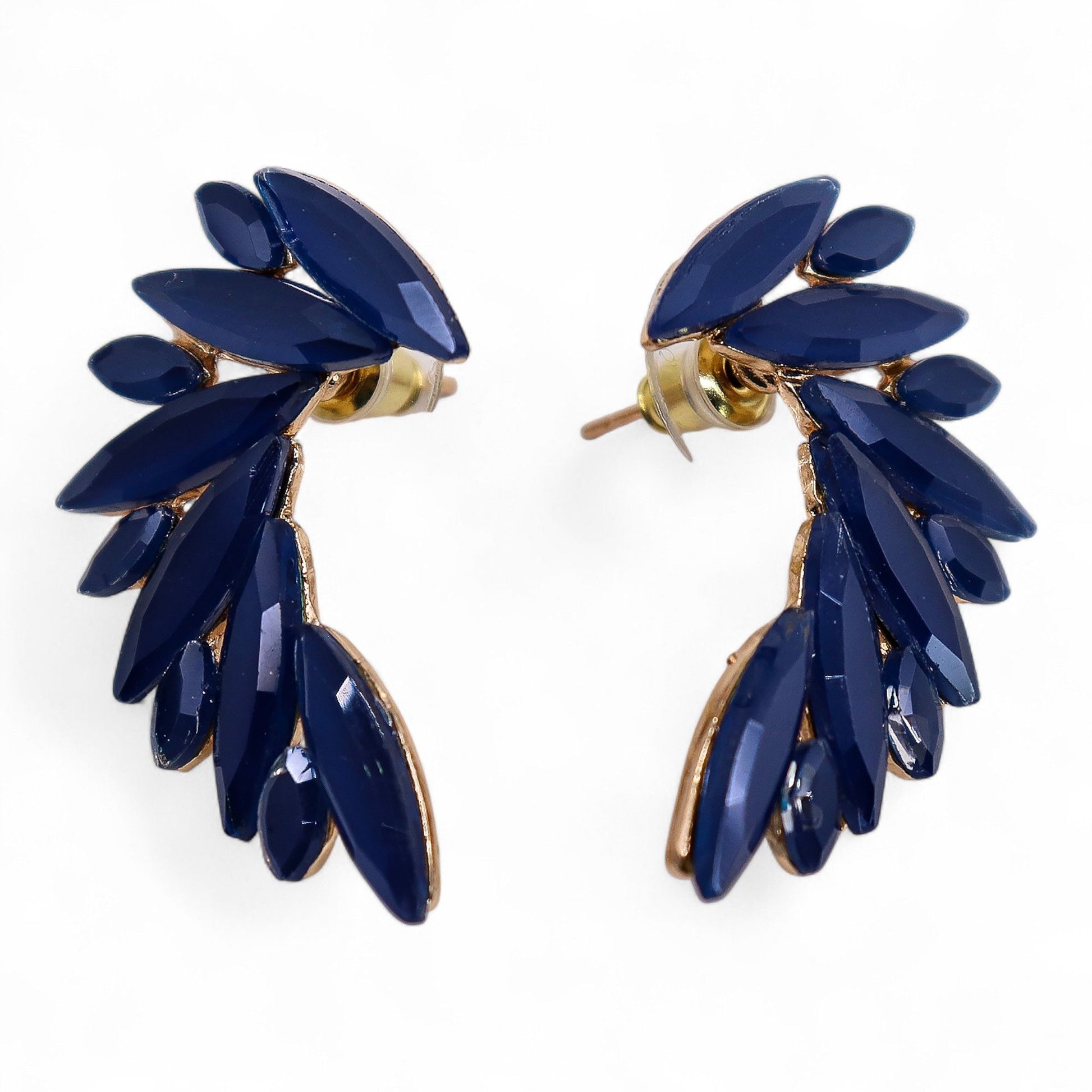 Intricate stainless steel angel wing earrings featuring vibrant royal blue vintage glass drops that shimmer in the light.
