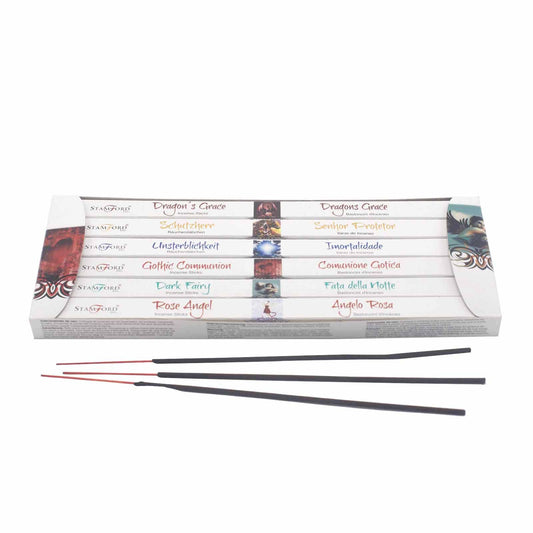 A collection of six colourful incense boxes arranged as a gift set, featuring spiritual-themed designs and sticks.