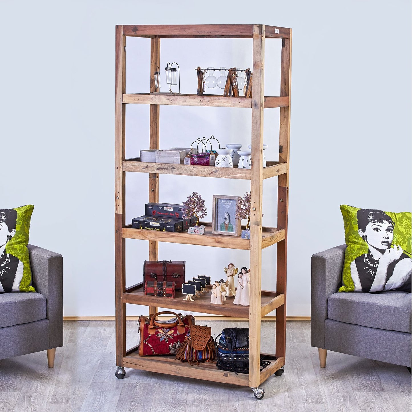 Handcrafted six-tier shelving unit made from colourful recycled boat wood on four black caster wheels.