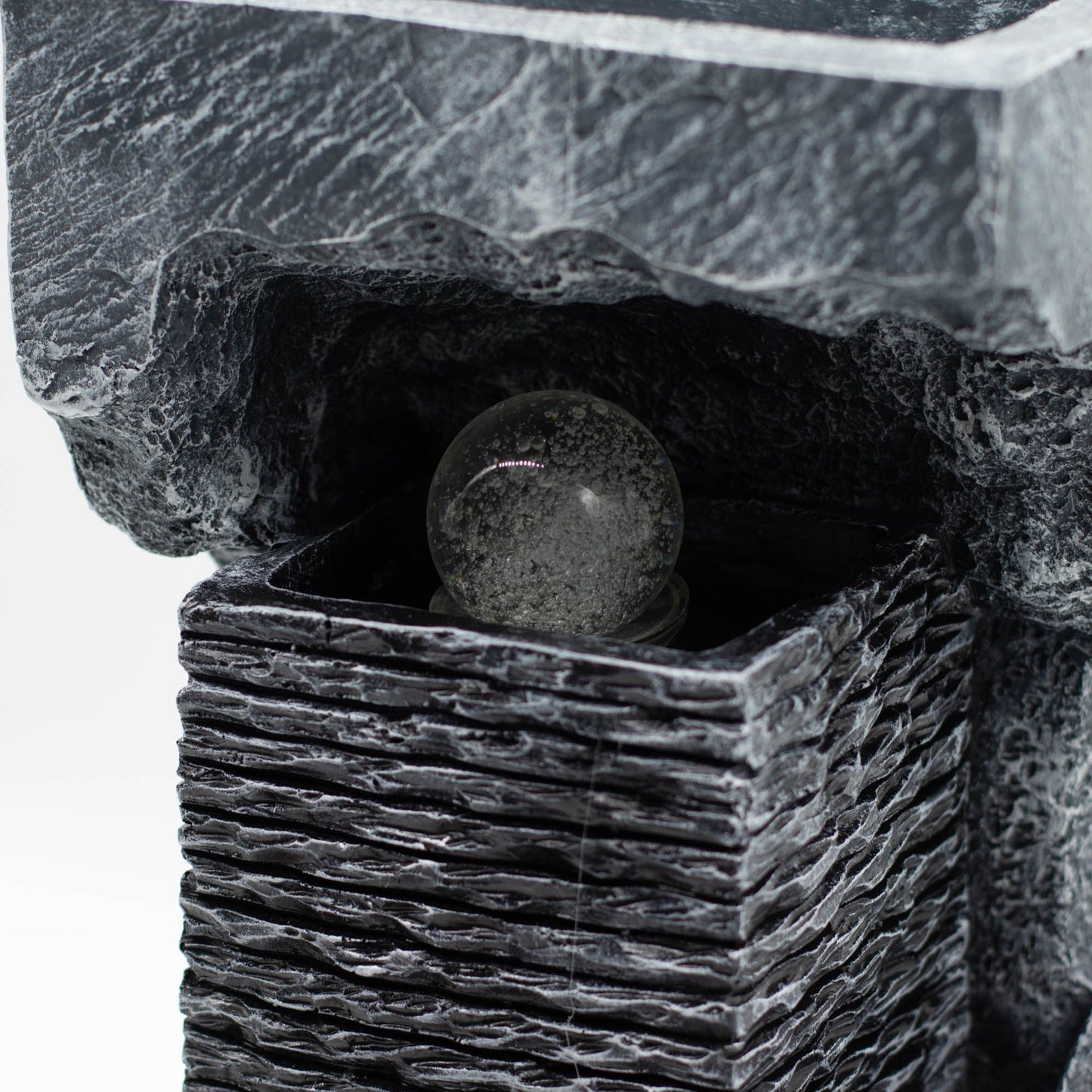 Large grey stone-effect tabletop water feature with a spinning crystal ball illuminated by colour-changing LED lights.