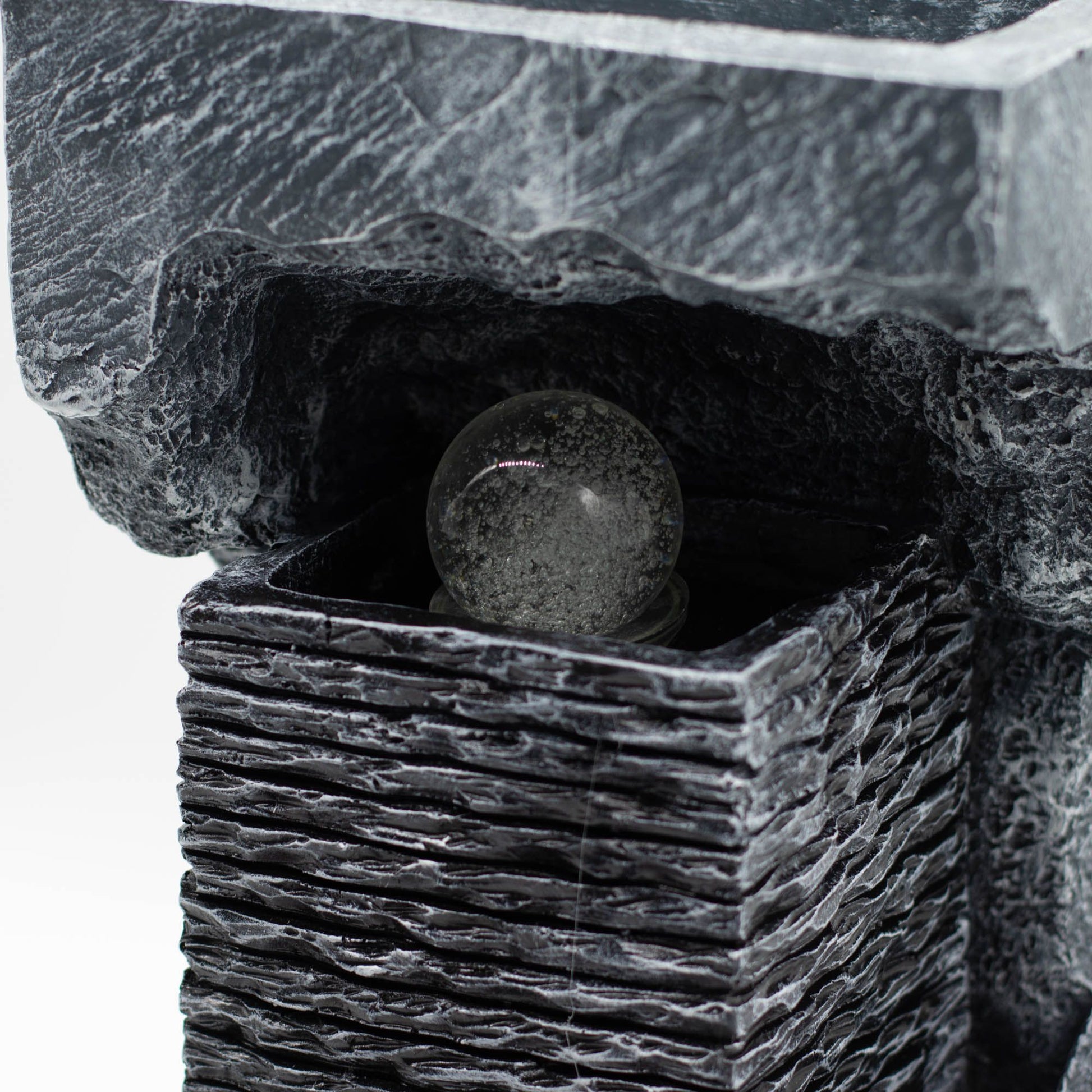 Large grey stone-effect tabletop water feature with a spinning crystal ball illuminated by colour-changing LED lights.