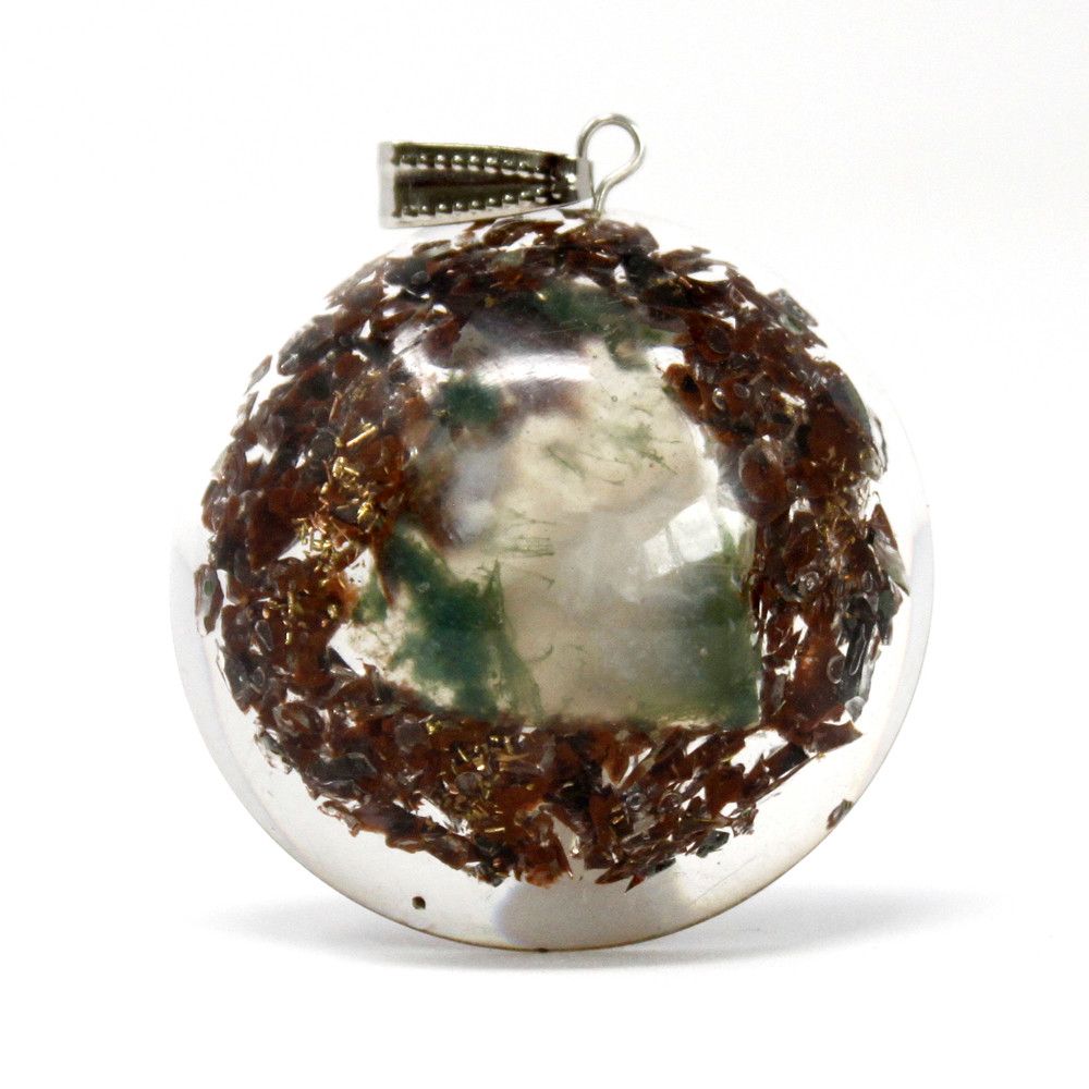 Dome shaped orgonite pendant featuring gemstone chips, copper coils, and metal filings for spiritual healing.