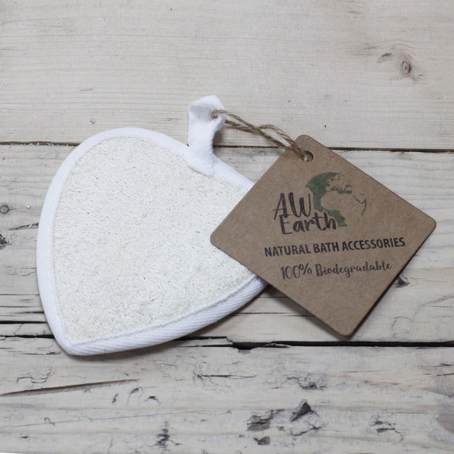 Heart-shaped natural fibrous loofah sponge for gentle body exfoliation and skincare.