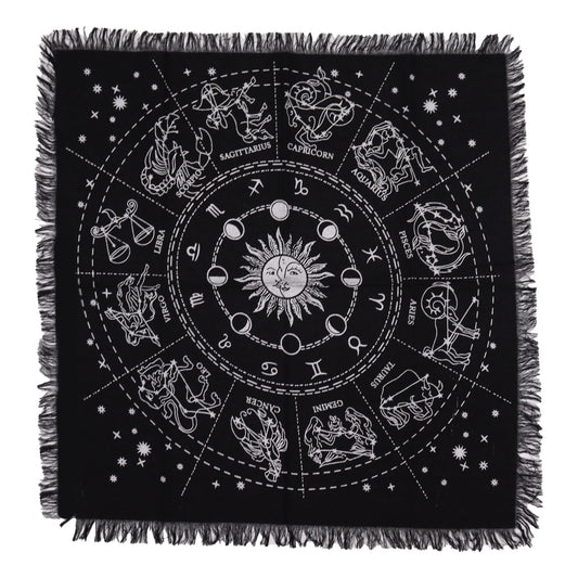 Square black altar cloth with white astrological horoscope wheel design and decorative fringed edges.