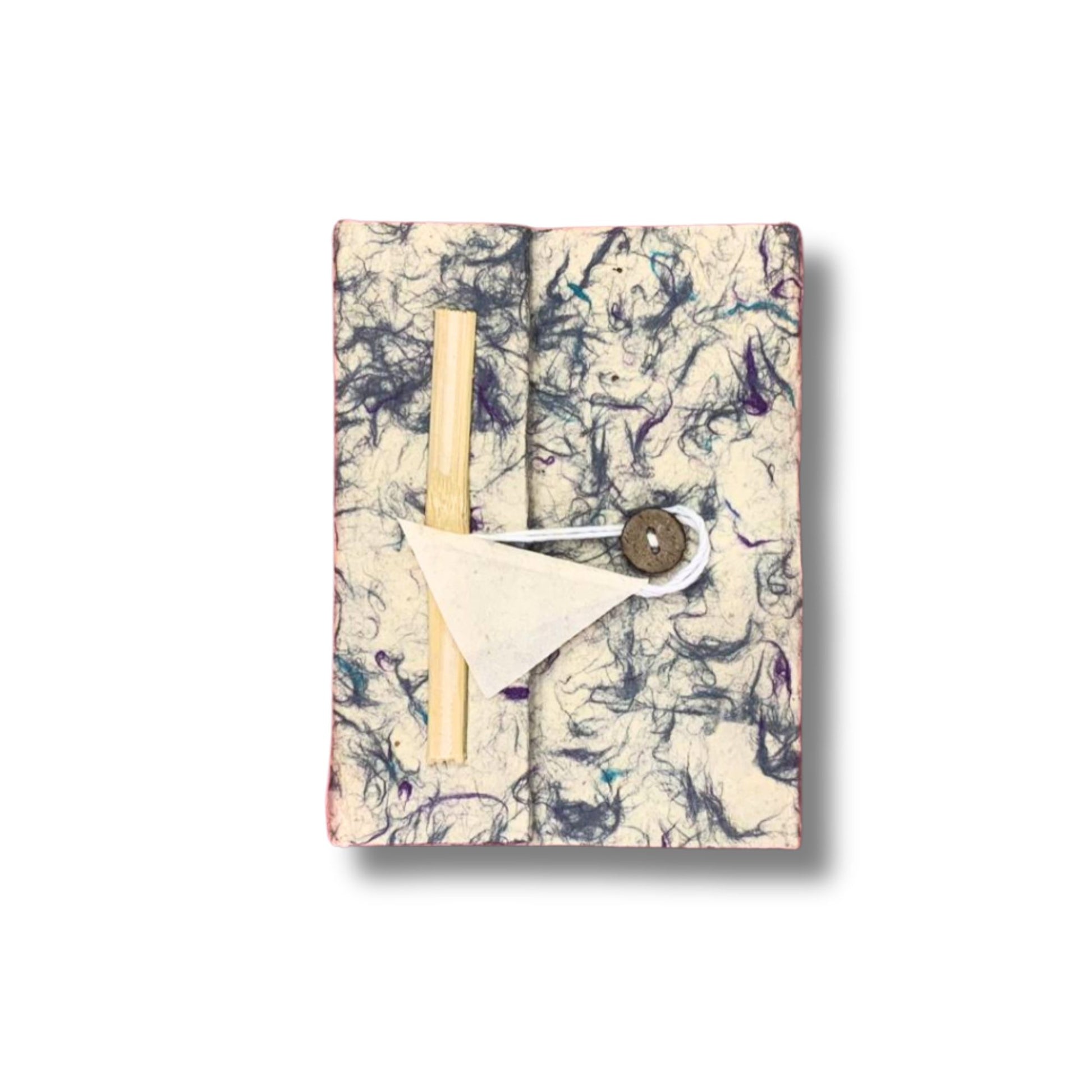 Handmade Lokta paper notebook with a soft textured blue cotton flecked cover and natural deckled edges.