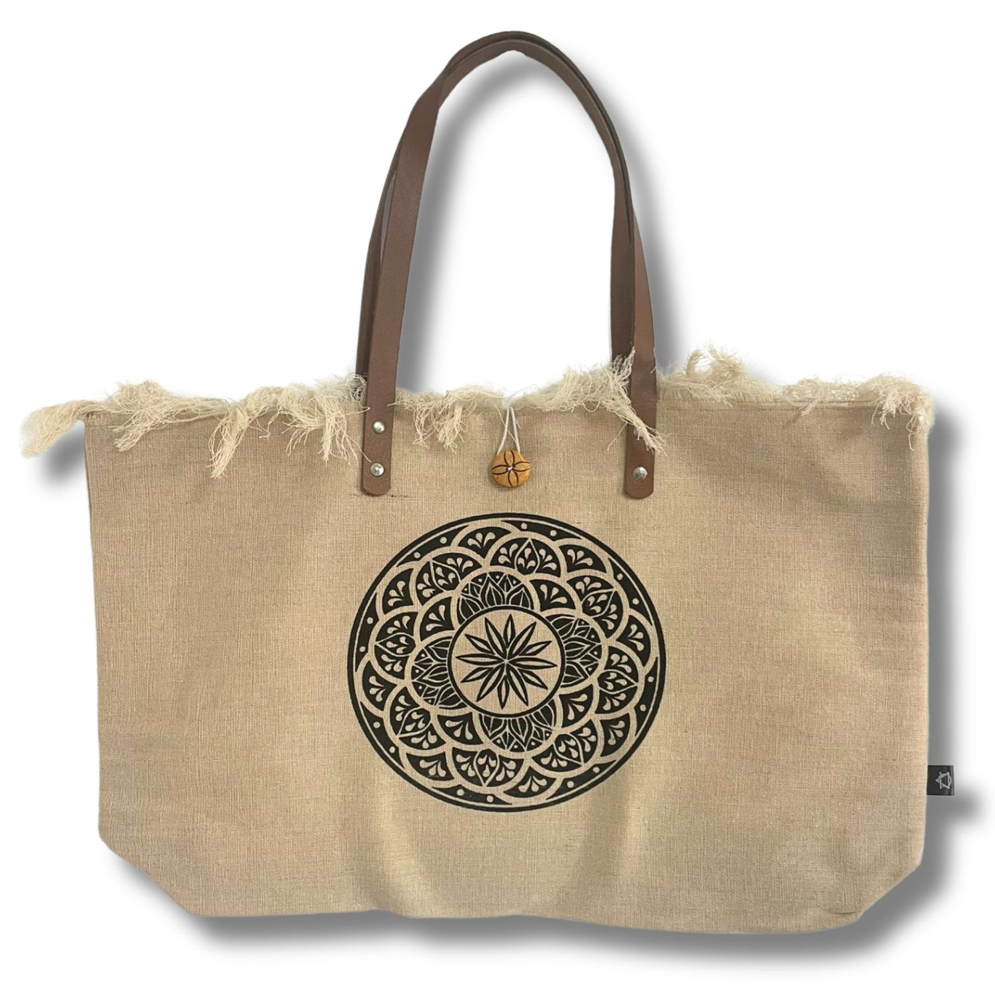 Eco-friendly natural fabric tote bag featuring a Mandela design and sturdy brown leather handles.