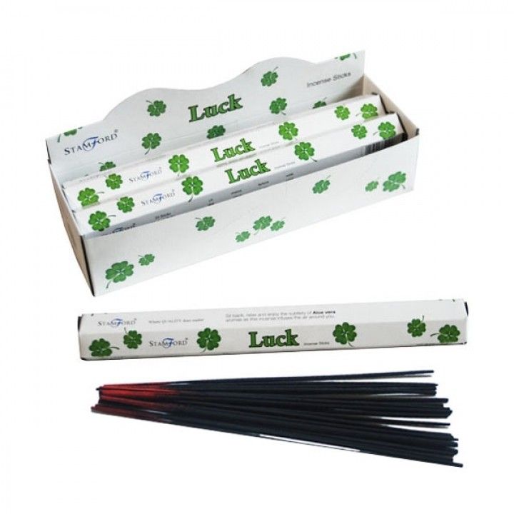 Hand-rolled premium incense sticks in a hexagonal box with gold and green lucky motifs.