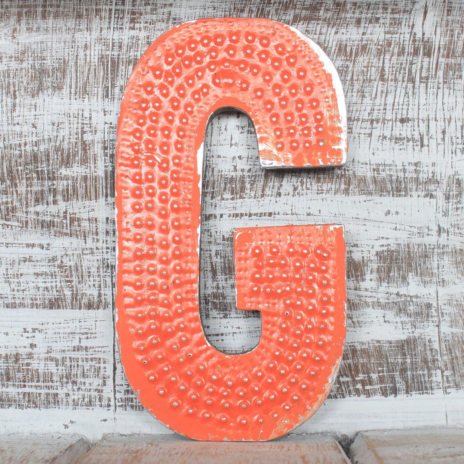Vintage style 15cm MDF and aluminium letter G with a distressed multicoloured finish and rustic decorative font.
