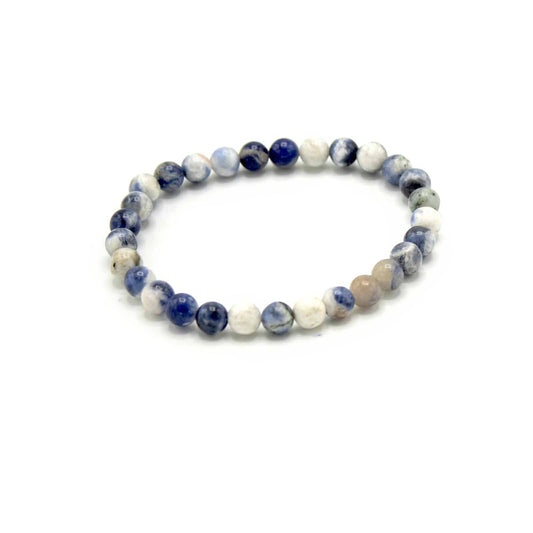 Blue and white marbled Sodalite gemstone manifestation bracelet with polished round beads on a stretch cord.