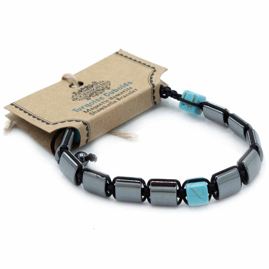 Magnetic hematite shamballa bracelet featuring sleek black beads and turquoise-coloured cuboid stones.