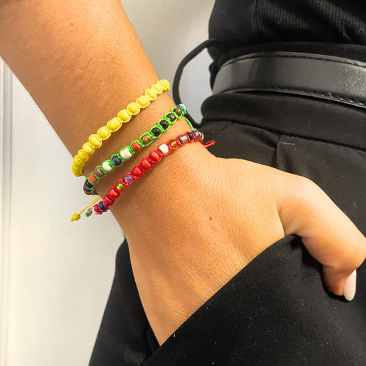 Delicate handmade friendship bracelets featuring colourful tiny forever beads on adjustable woven cords.