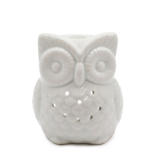 Elegant tall white ceramic oil burner featuring a decorative owl cutout design on a smooth glazed surface.