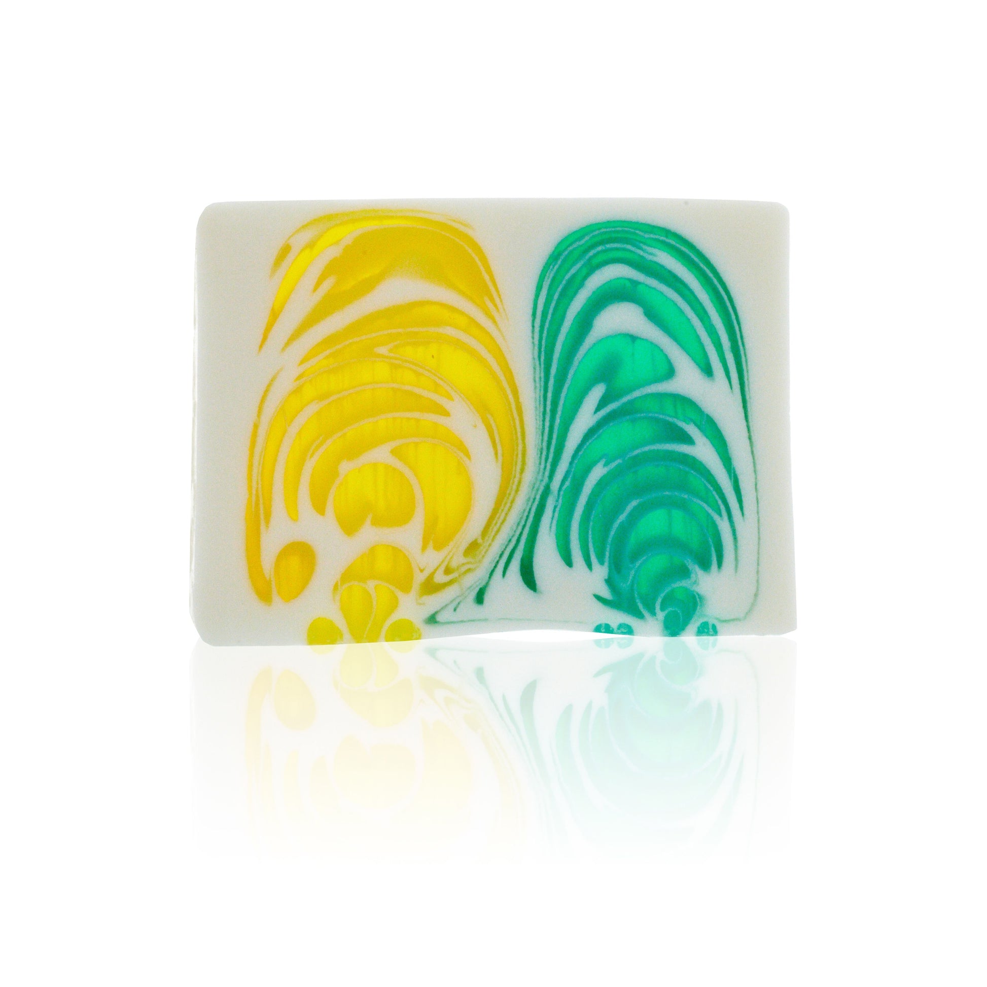 A textured slice of yellow and orange artisanal soap with a rustic, handcrafted finish.