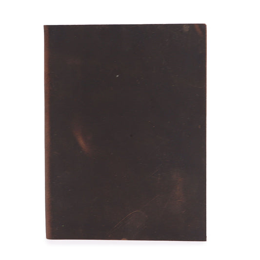 Handcrafted black and tan leather daily notebook with 100 lined pages and a vintage wrap-around strap design.