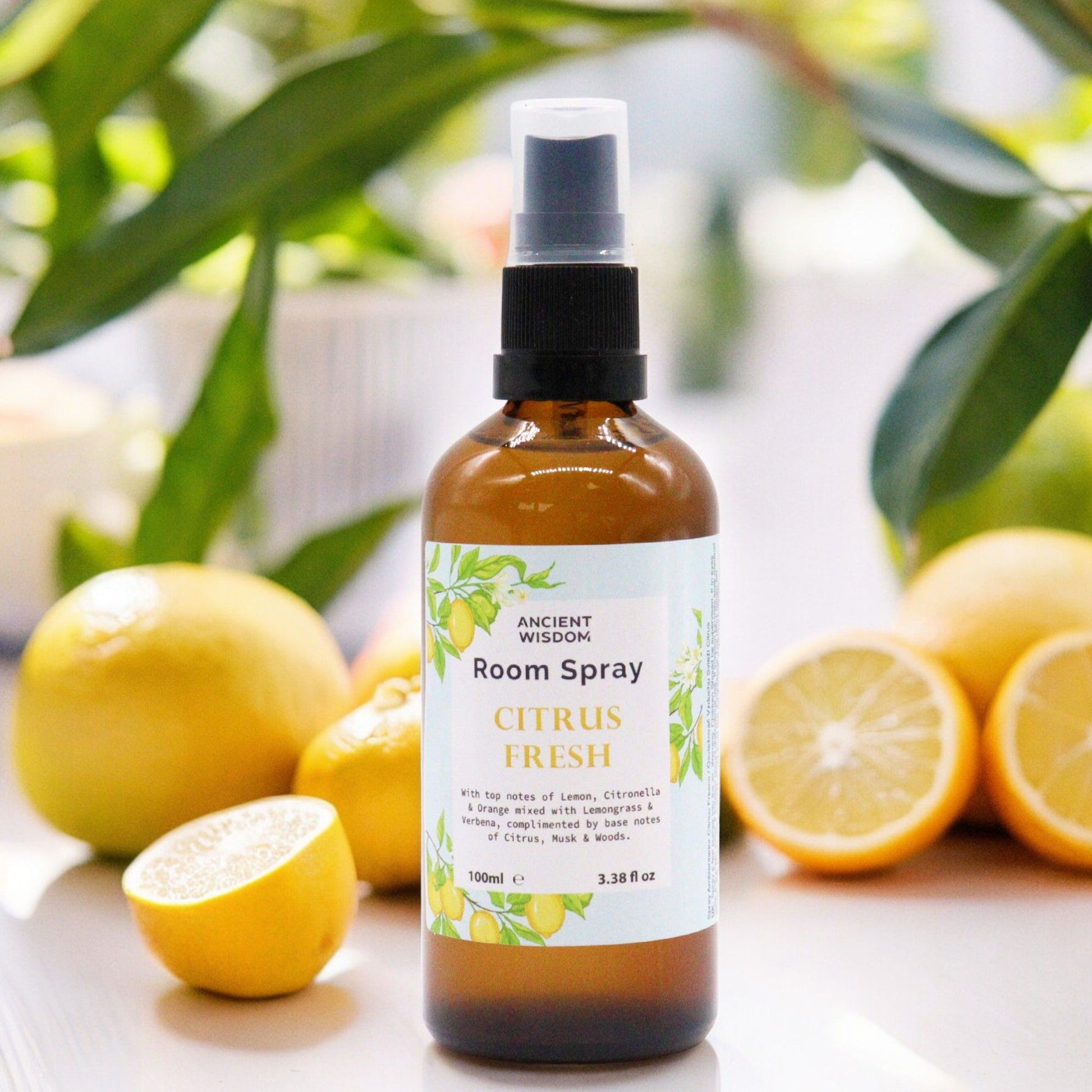 Clear 100ml bottle of Citrus Fresh room spray with a minimalist label in a bright, clean setting.