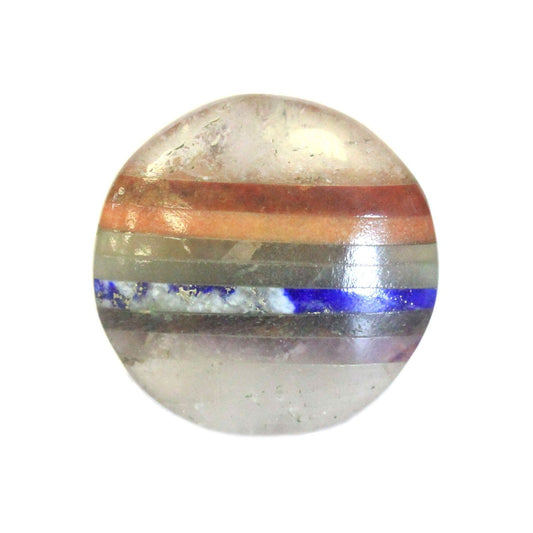Handcrafted oval crystal palm stone with seven vibrant bonded gemstone layers representing the different chakras.