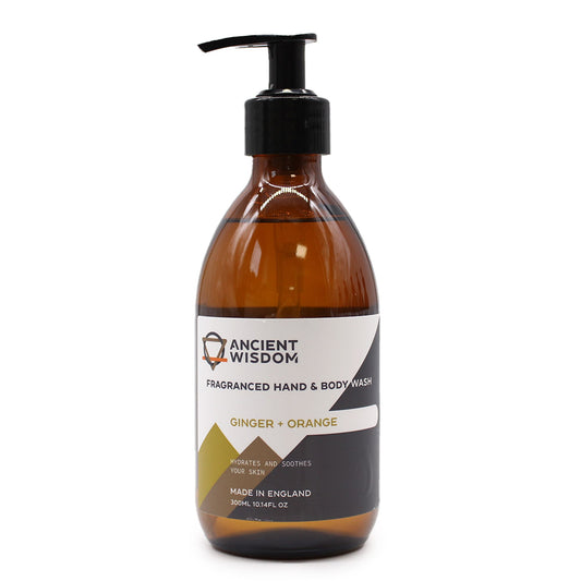 Clear bottle of vibrant orange liquid hand and body wash with a black pump dispenser.