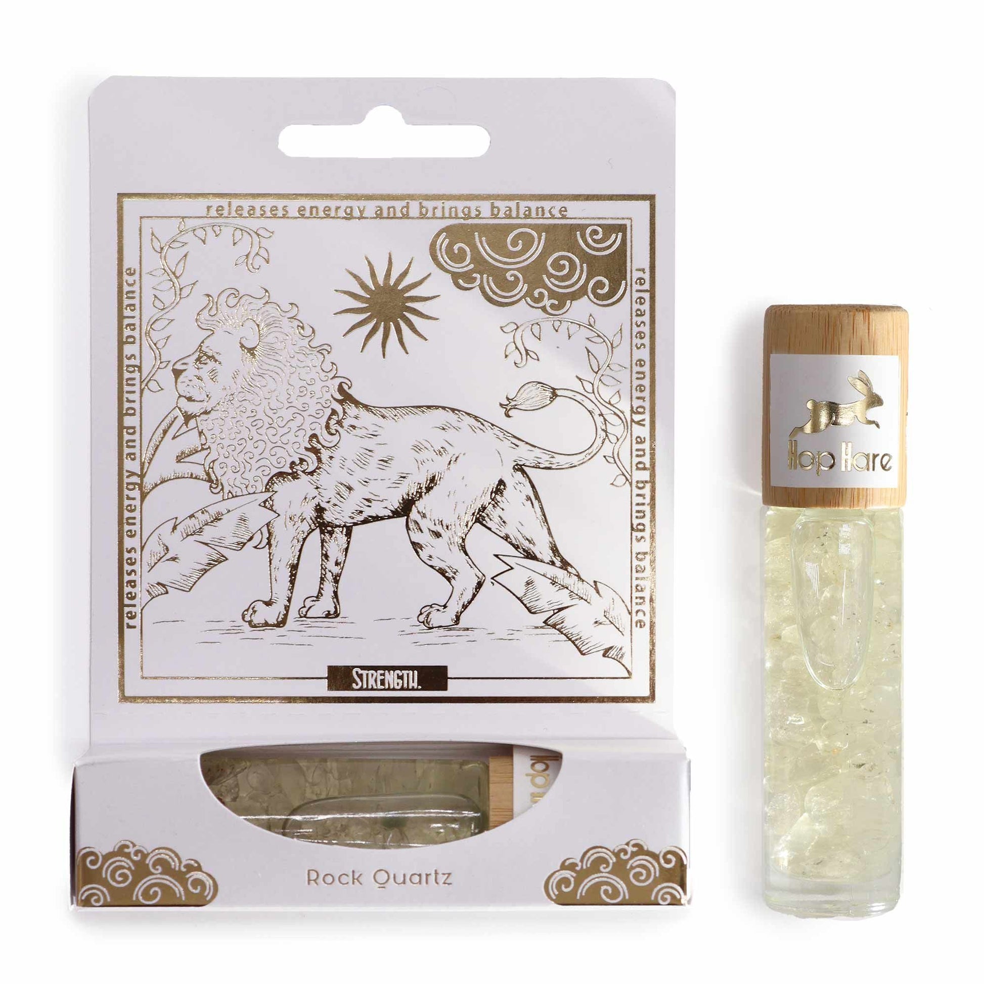 Glass essential oil roll-on bottle with a tarot-inspired lion label and clear Rock Quartz gemstones inside.