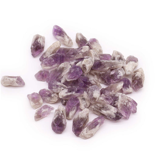 A collection of natural purple amethyst rough crystal points in their raw, uncut state.