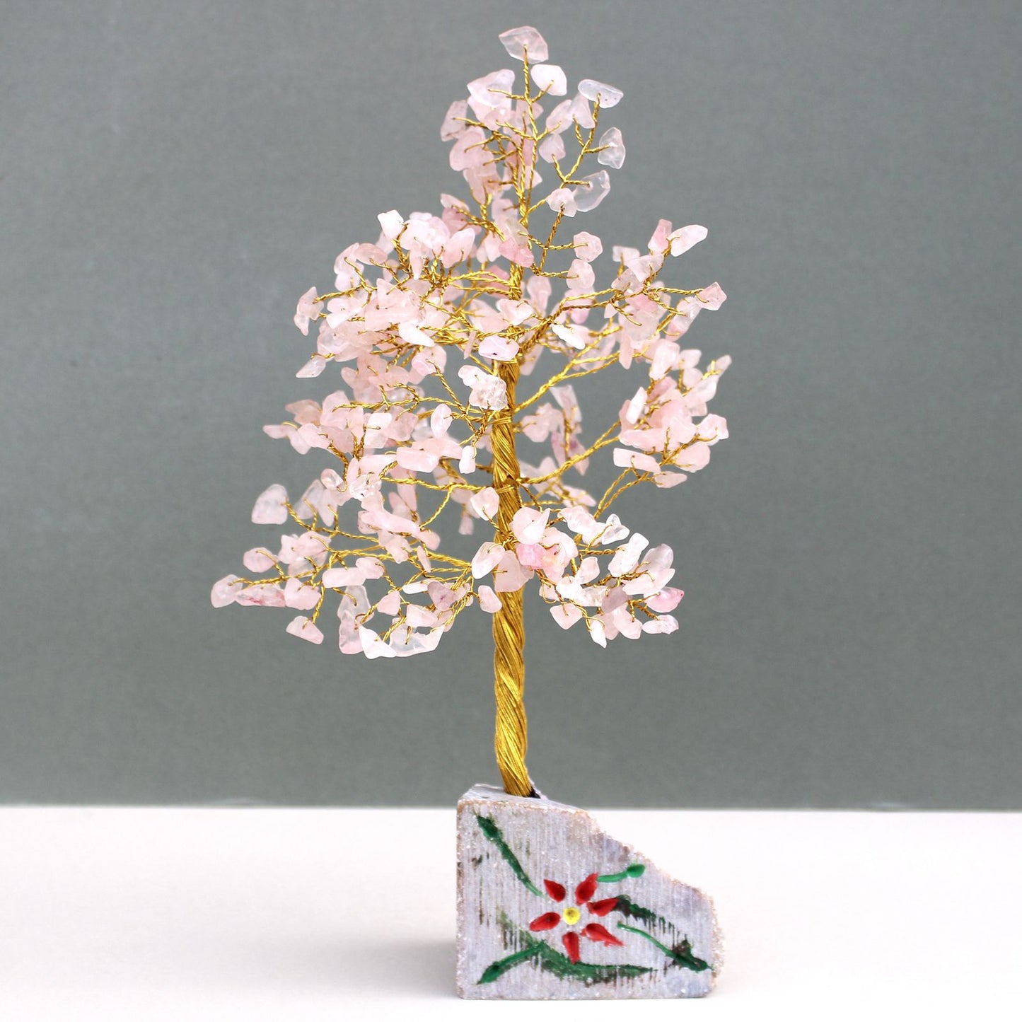 Handmade rose quartz gemstone tree with 320 pink stones on adjustable wire branches and a natural stone base.