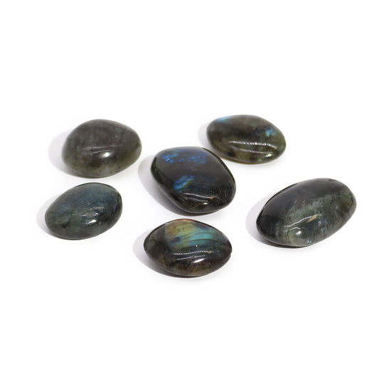 Smooth oval Madagascar Labradorite palm stone showing iridescent flashes of blue, green, and gold across its surface.