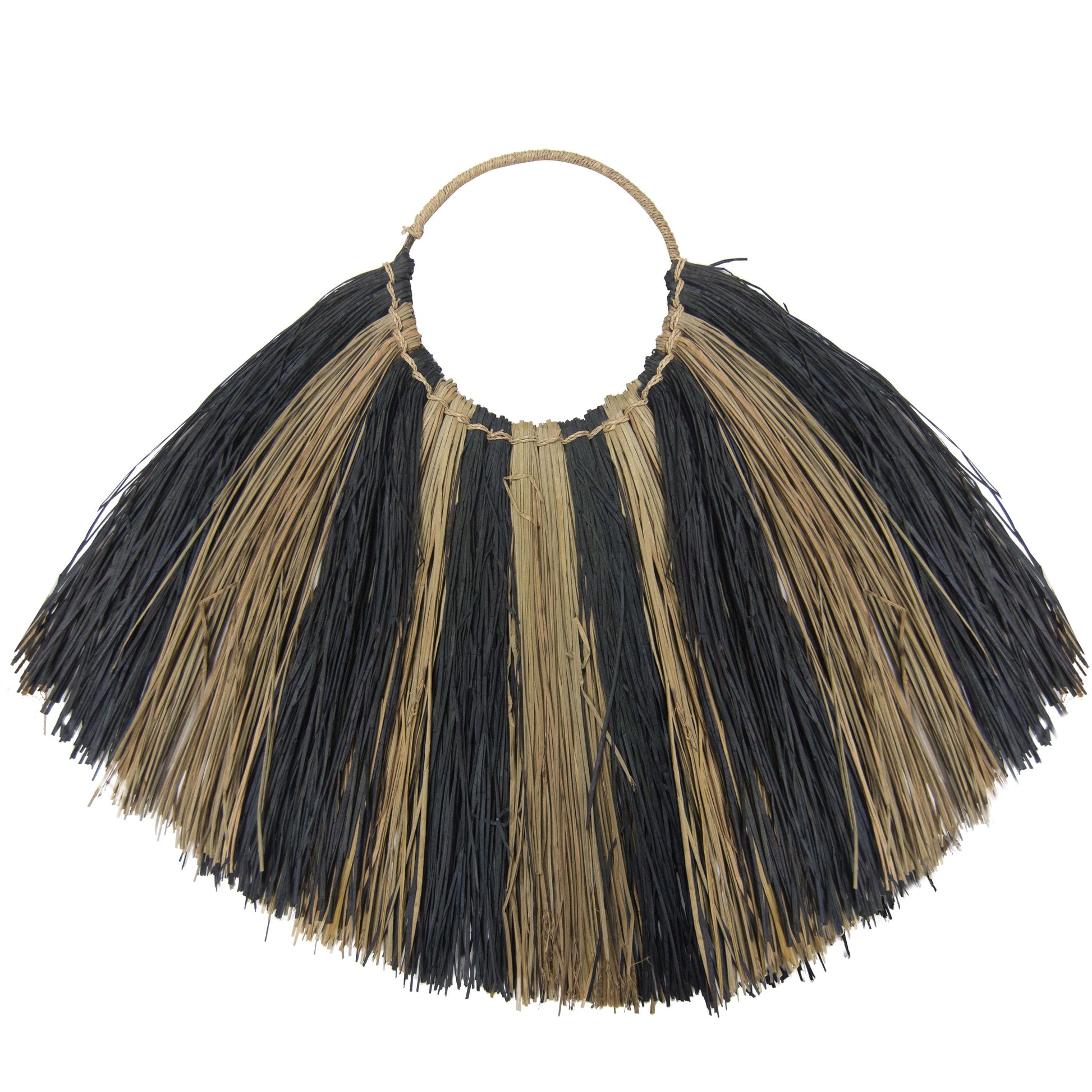 Large fan-shaped seagrass wall hanging with a black and white zebra pattern, handcrafted by Indonesian artisans.