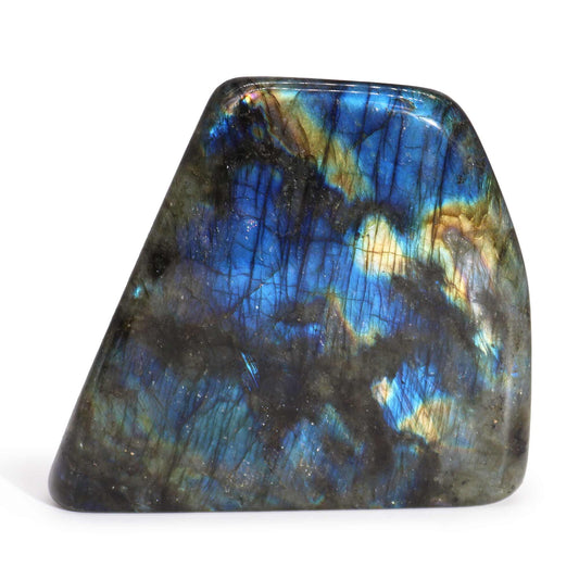 Large polished Madagascar Labradorite stone with a mesmerising iridescent blue and gold flash on a dark grey surface.