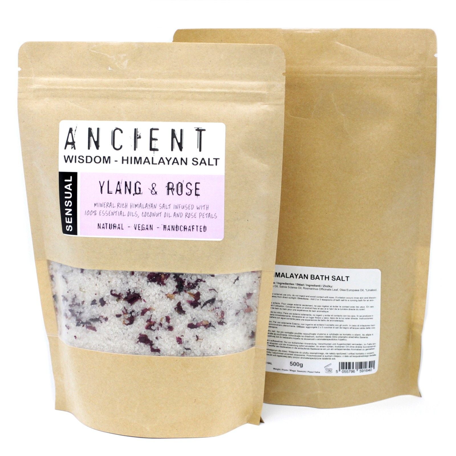 Pink Himalayan bath salts mixed with dried red rose petals and infused with essential oils in a glass jar.