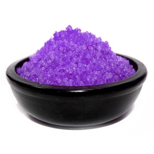 Small white simmering granules for oil burners used to fragrance a living room space.