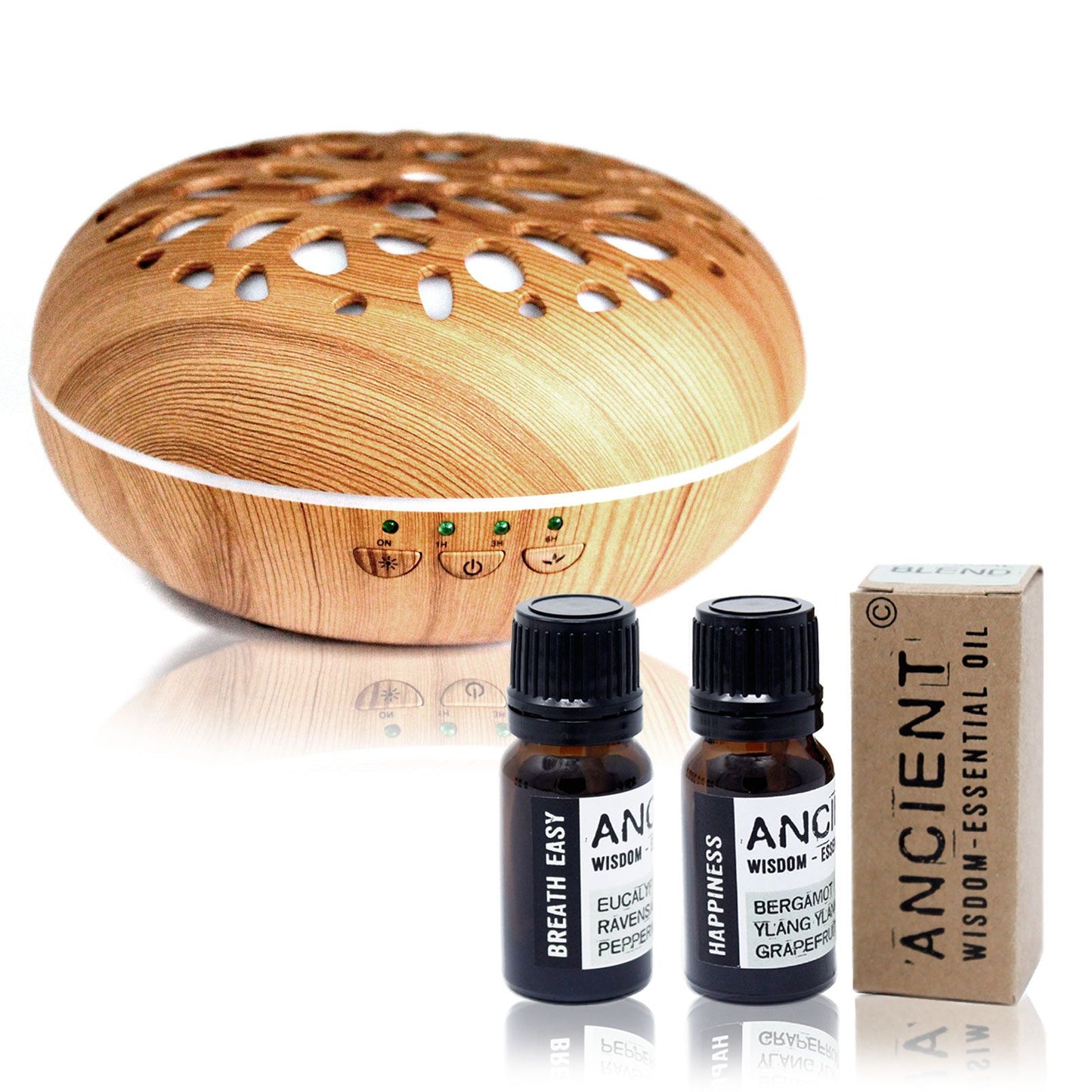 Minimalist white ultrasonic aroma diffuser alongside two amber glass essential oil bottles on a clean surface.