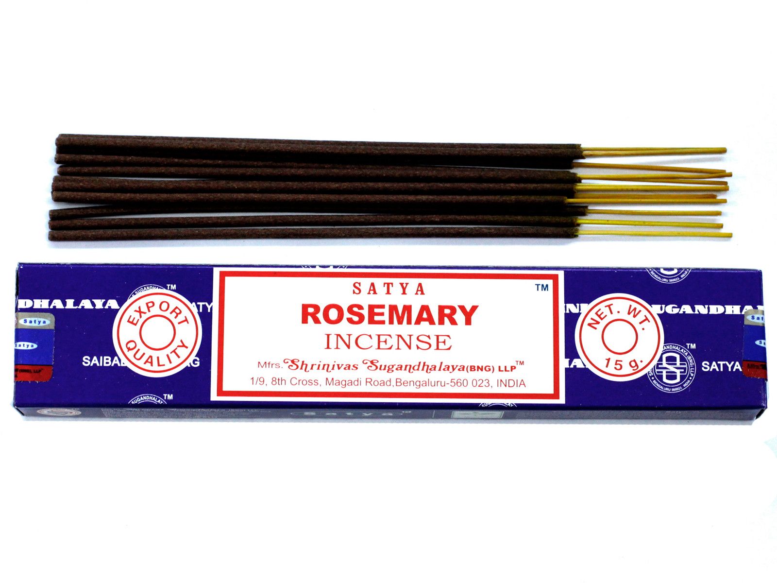 Hand-rolled rosemary incense sticks in a blue box on a wooden surface with a soft glow.