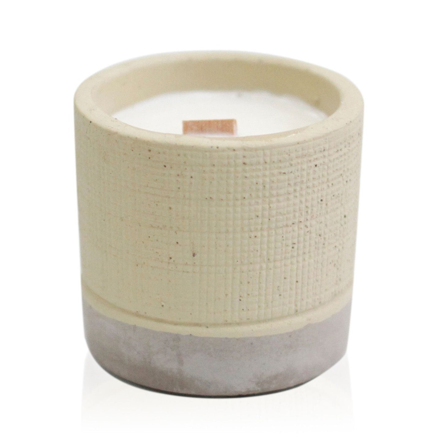Minimalist grey concrete pot candle with a natural wooden wick and a raw, textured industrial finish.