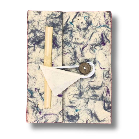 Large handmade Lokta paper notebook with a blue cotton speckled cover, rustic string tie, and matching bookmark.