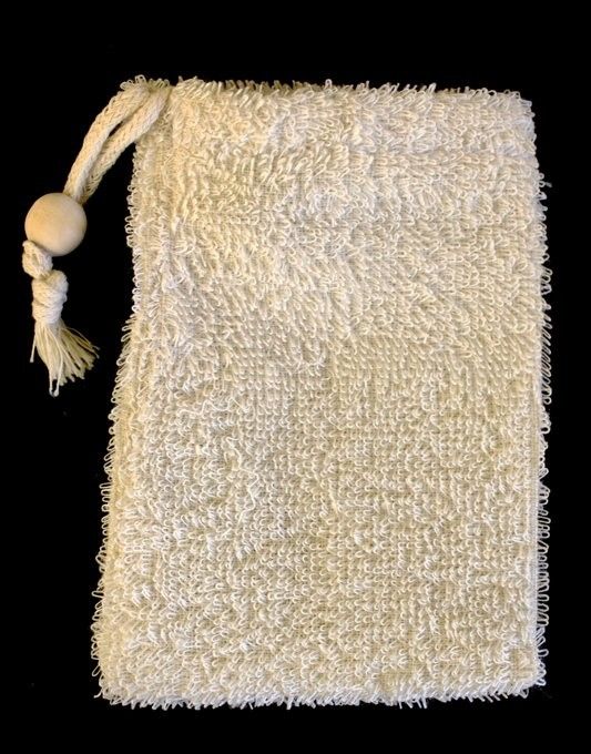 Textured natural ramie fibre soap bag with a drawstring closure for exfoliation and bathing.