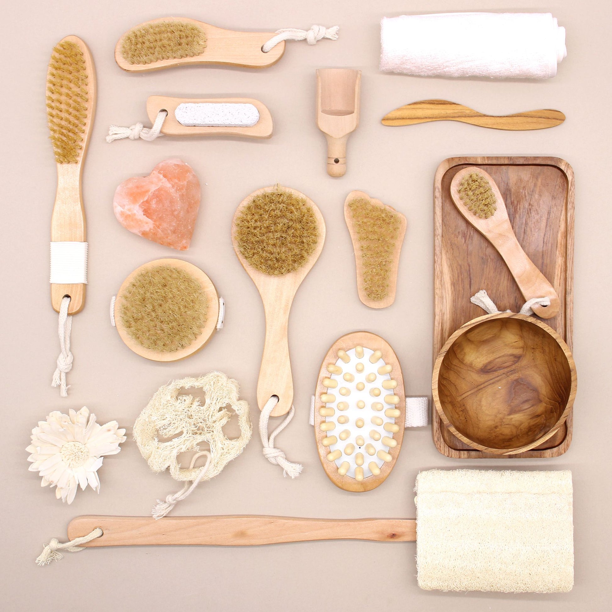 Small wooden exfoliating brush in the shape of a foot with natural bristles for smoothing skin.