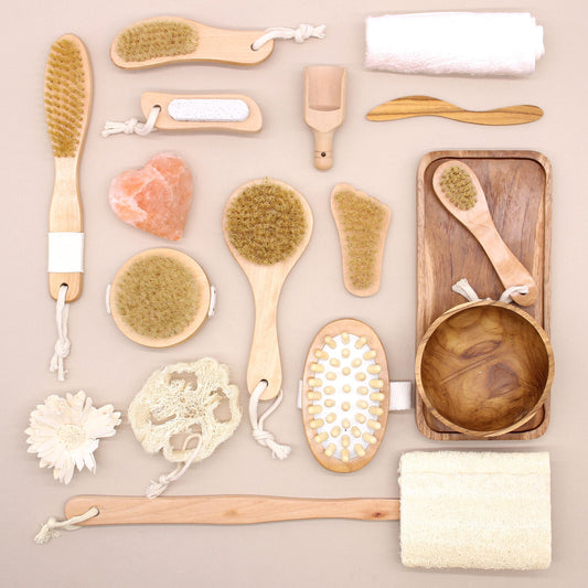 Small wooden exfoliating brush in the shape of a foot with natural bristles for smoothing skin.