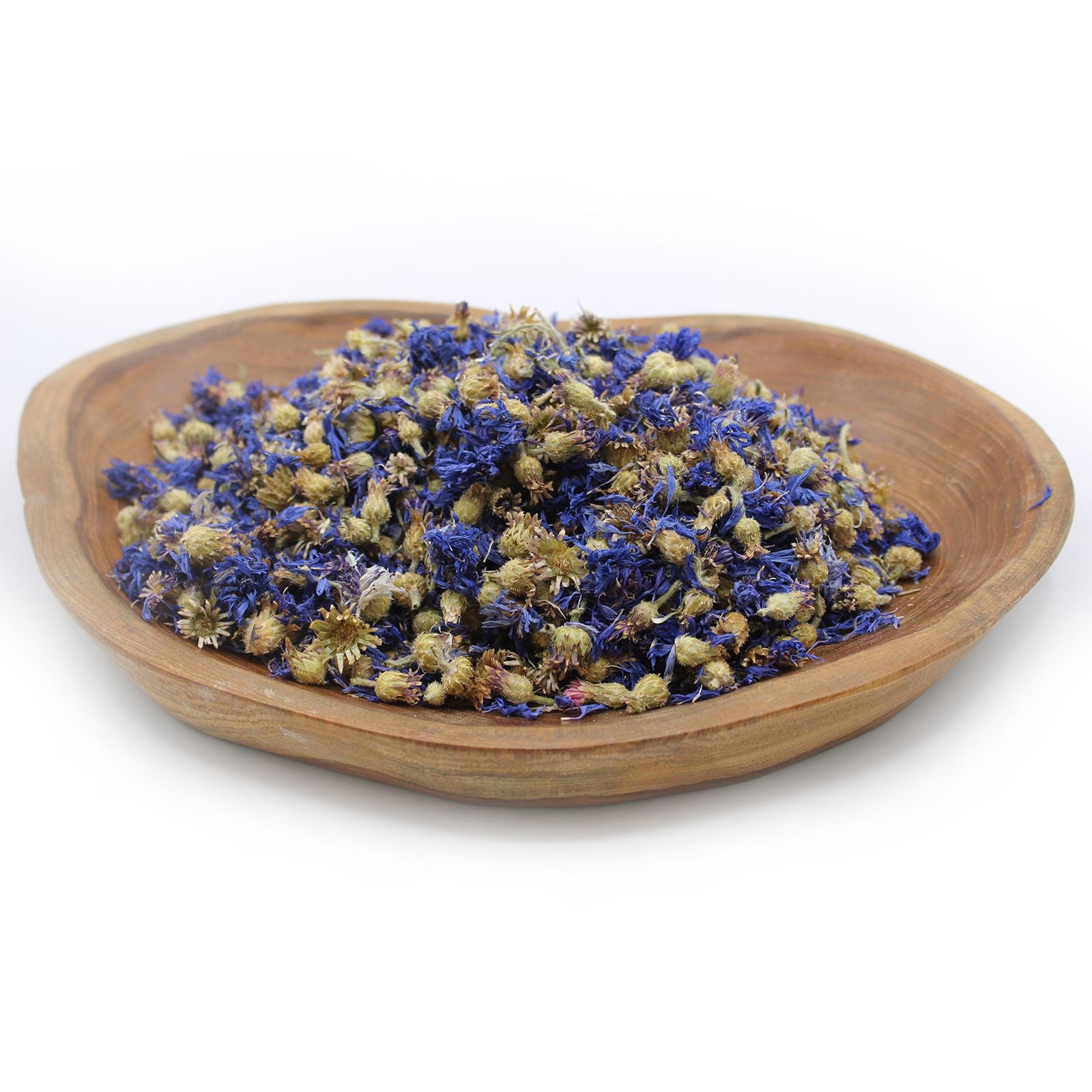 Large bag of vibrant dried whole blue cornflower petals and flower heads on a neutral background.