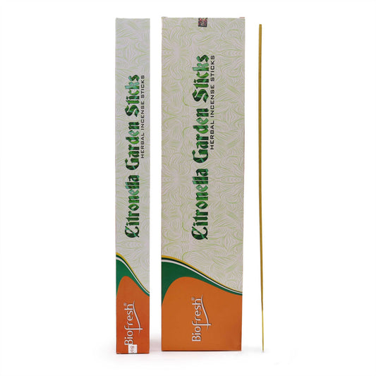 Extra long citronella incense sticks for garden use, standing fifty centimetres tall in a natural setting.