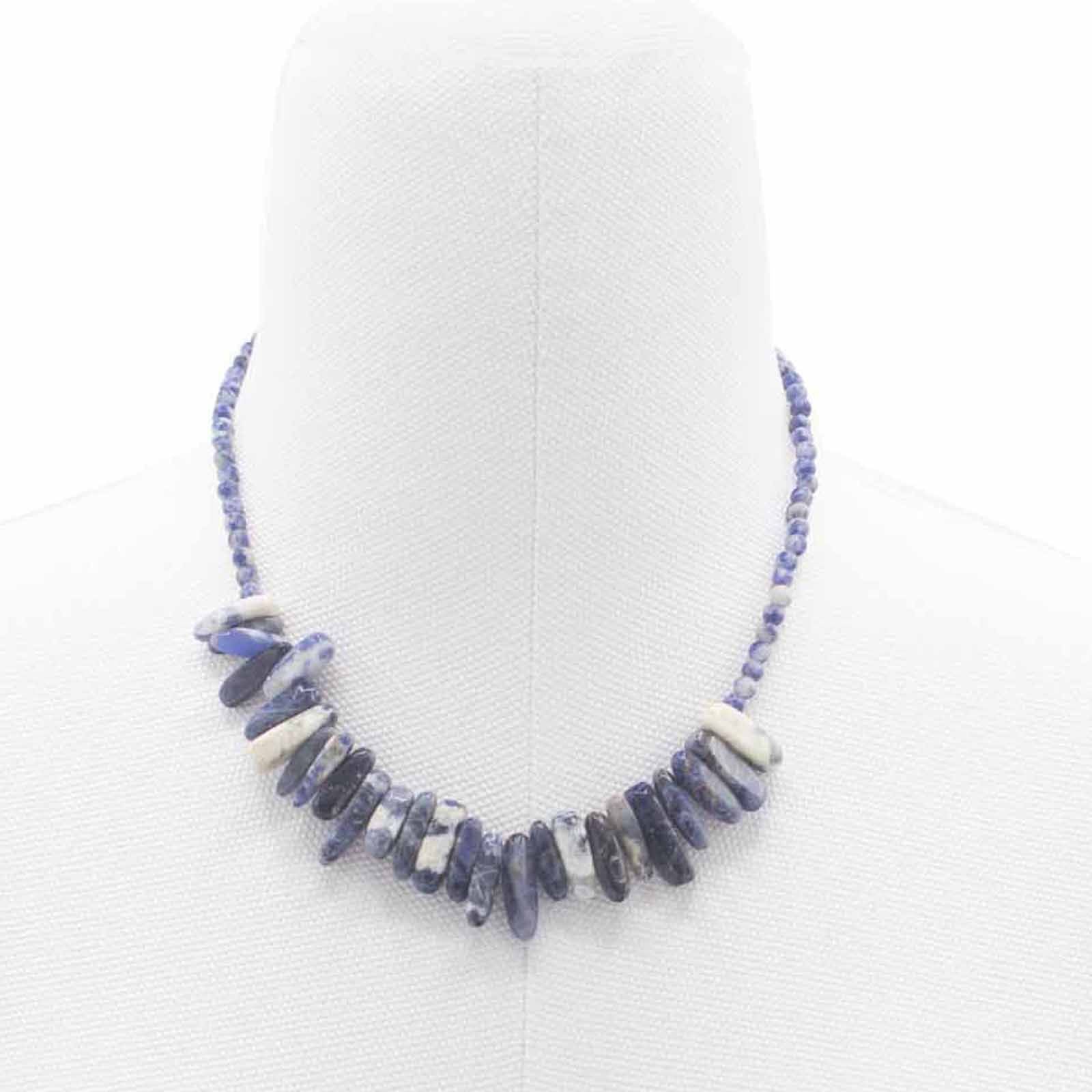 A longstone-shaped Sodalite gemstone necklace featuring deep royal blue patterns on a delicate silver-coloured chain.
