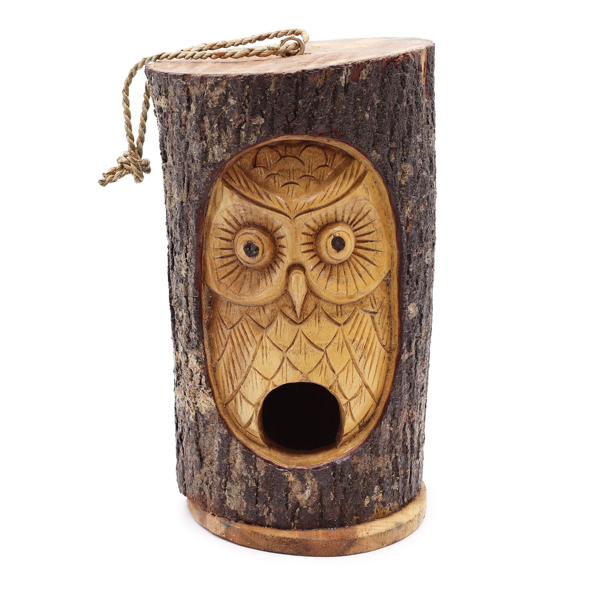 Hand-carved rustic wooden bird house made from a natural tree trunk with an intricately detailed wise owl face design.