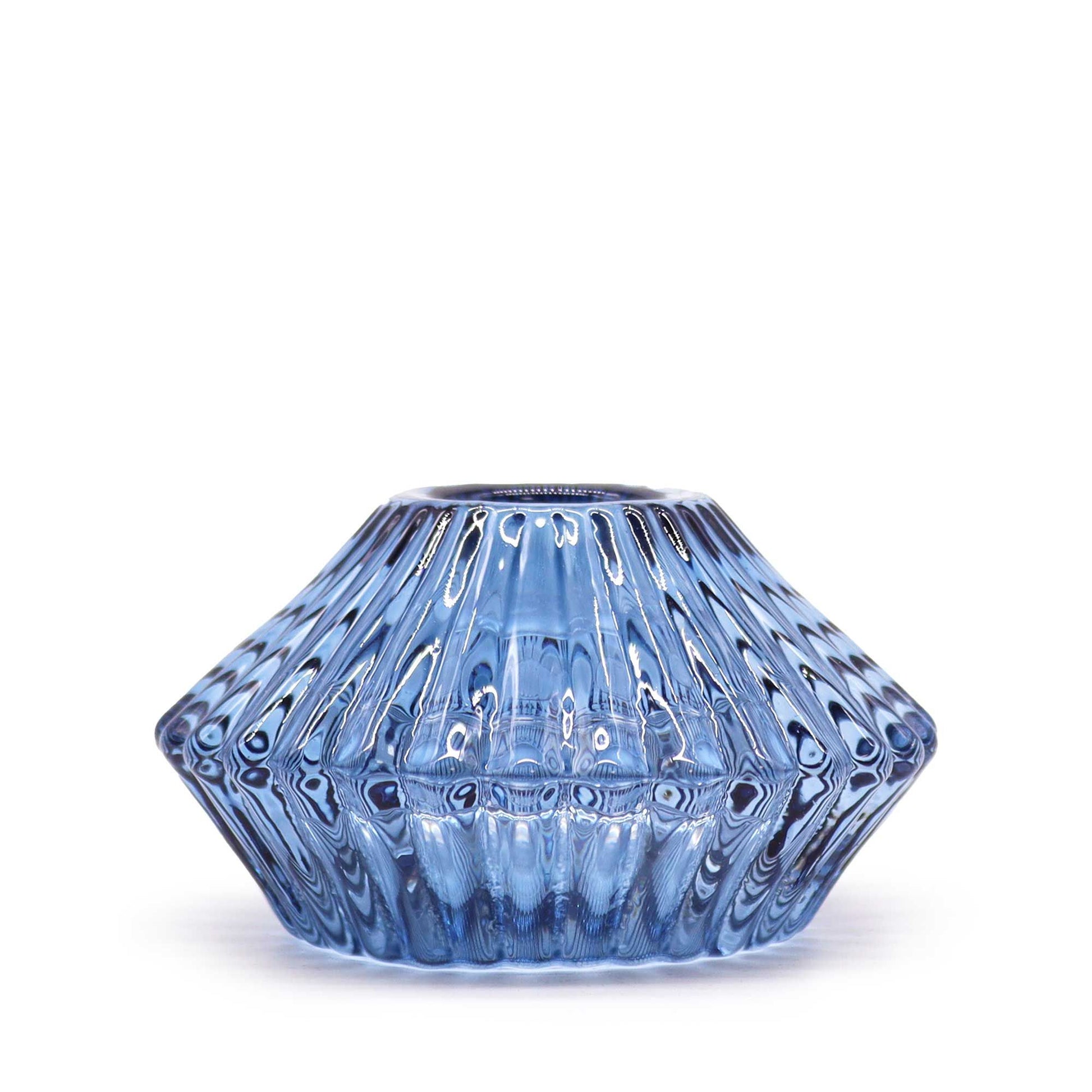 Elegant royal blue glass flower-shaped candle holder designed to hold both dinner candles and tealight candles.