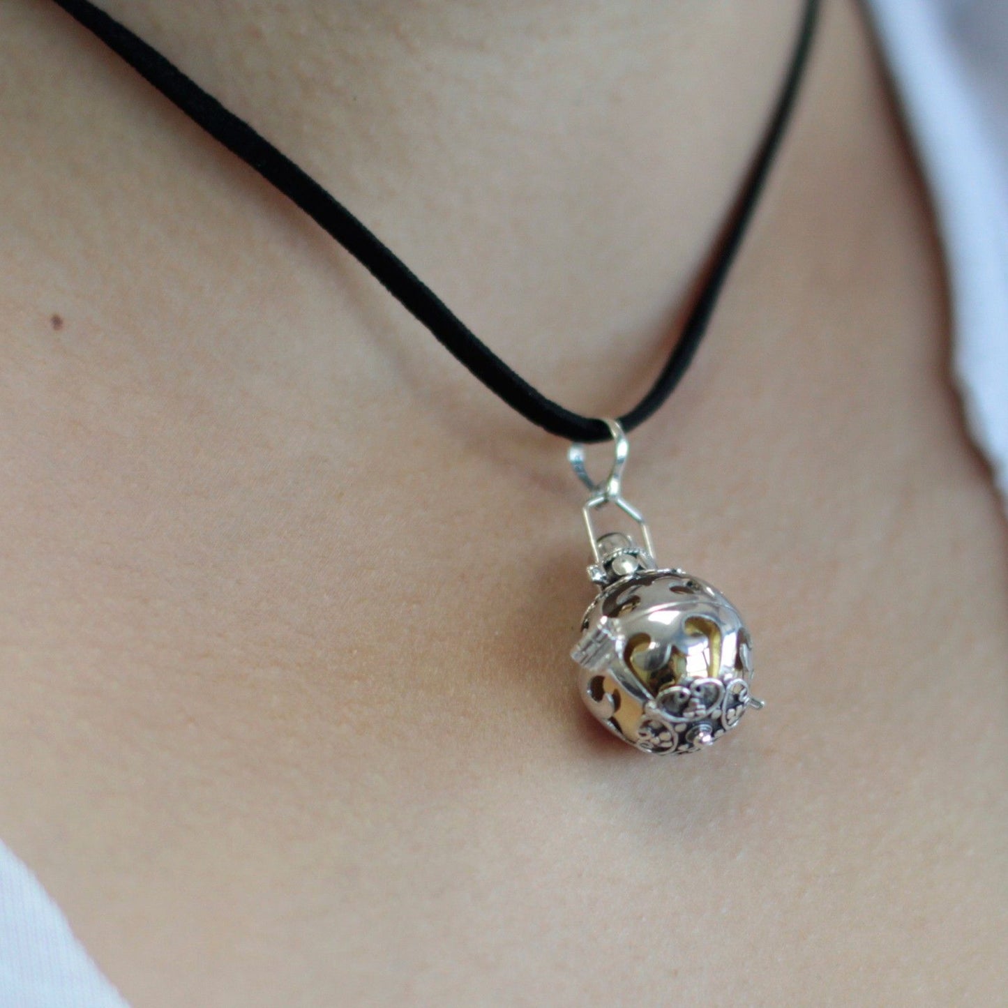 Intricately detailed 18mm 925 silver angel bell pendant with a traditional Balinese design and circular bale.