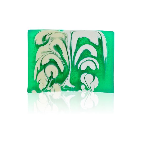 A vibrant orange handcrafted soap slice with a textured top, showing natural botanical inclusions.