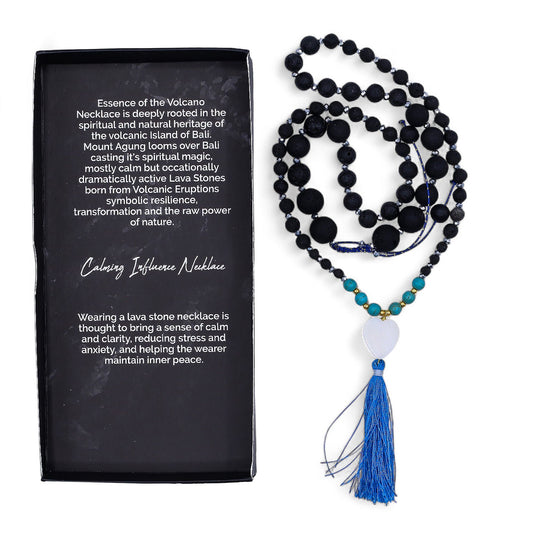 Handcrafted necklace featuring dark porous lava beads interwoven with bright blue turquoise accents.