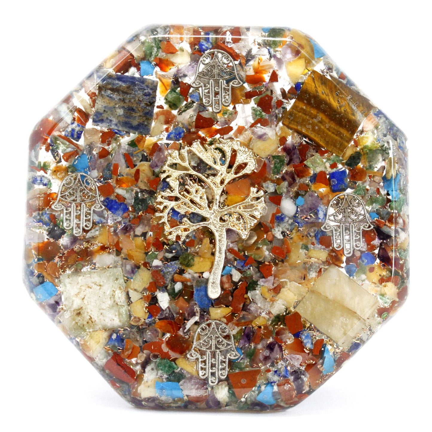 Large pyramid-shaped orgonite paperweight with a tree of life symbol, gemstone chips, and copper shavings.