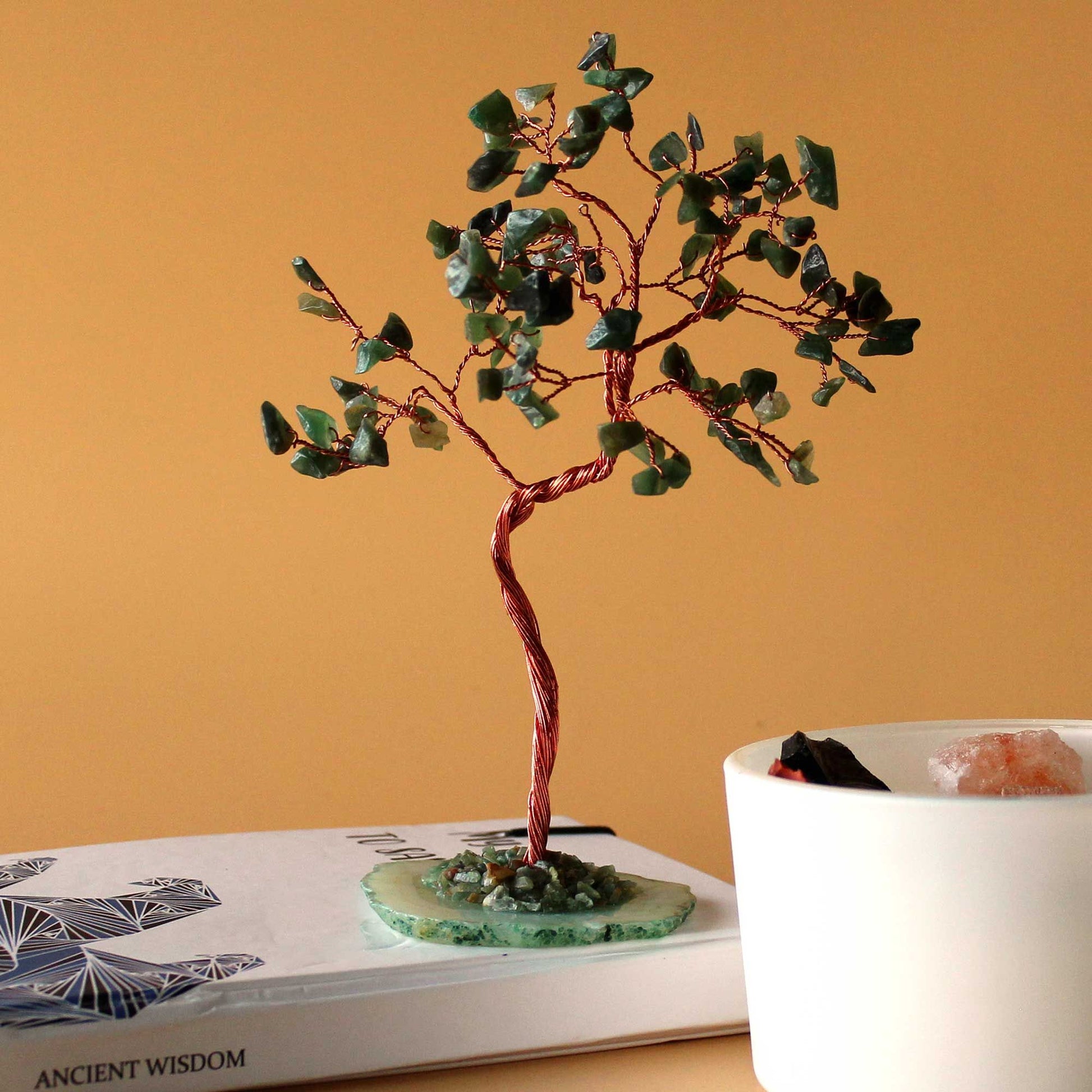 Large gemstone tree featuring green aventurine crystal leaves on a natural green agate base with copper wire branches.